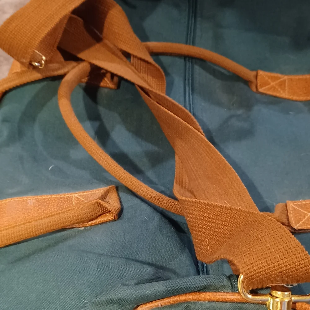 Duffle bag fancy straps are nice accents to this bag